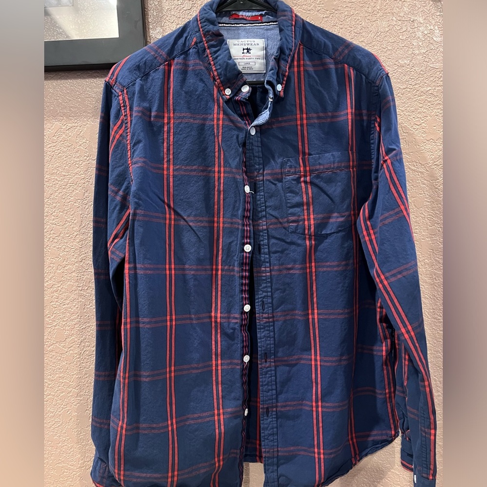 Blue long sleeved button down shirt